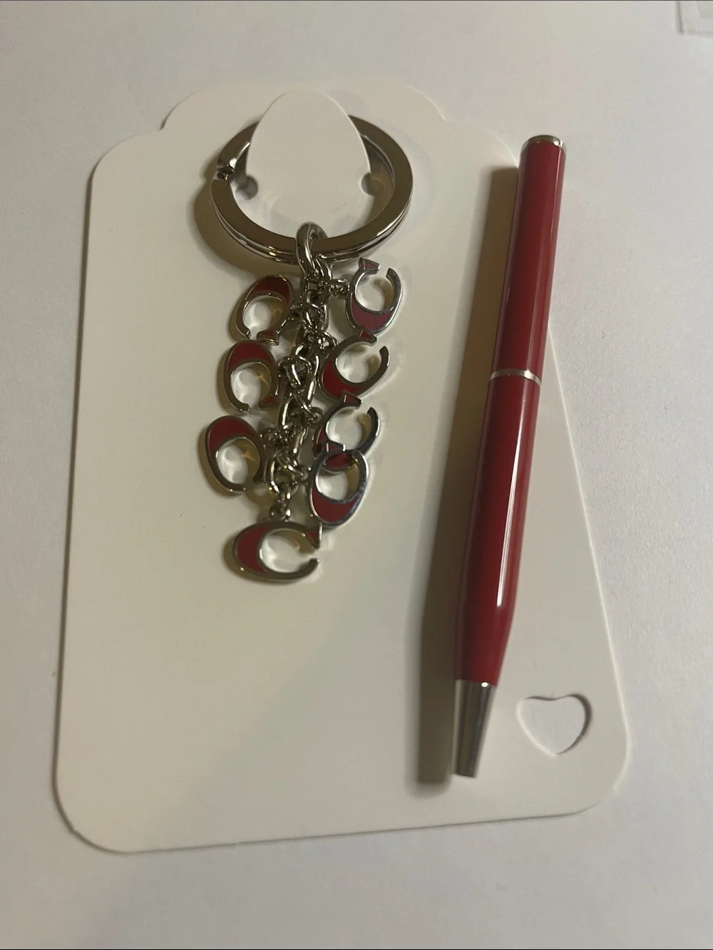 Coach Silver-Tone Keyring with Red Enamel 'C' Charms and Coach Pen